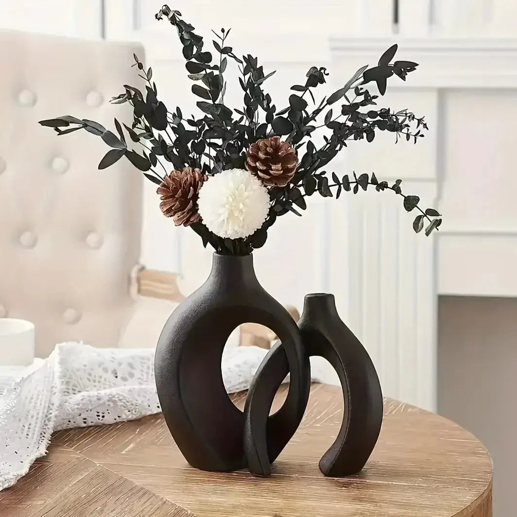 Chic Boho Ceramic Vases Set by NestNexus with unique hollow design and floral arrangement, perfect for modern home decor.