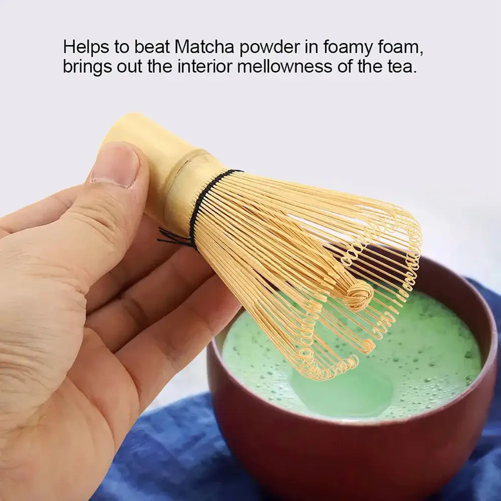 Bamboo Matcha Whisk Tool - NestNexus held above a bowl of matcha tea, ideal for creating frothy beverages.