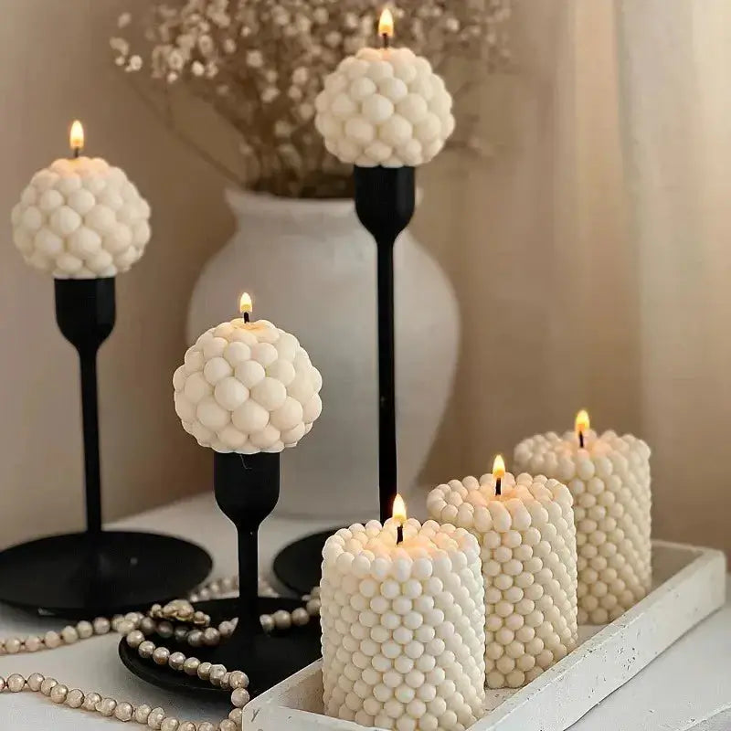 Beautiful bubble candles created using the bubble candle mold, showcasing unique bubble designs and warm candlelight.