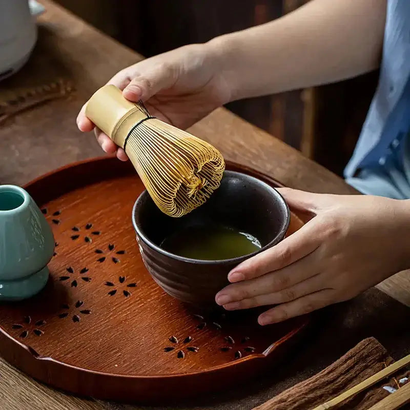 Bamboo Matcha Whisk Tool - NestNexus being used to whisk matcha green tea in a traditional setting.