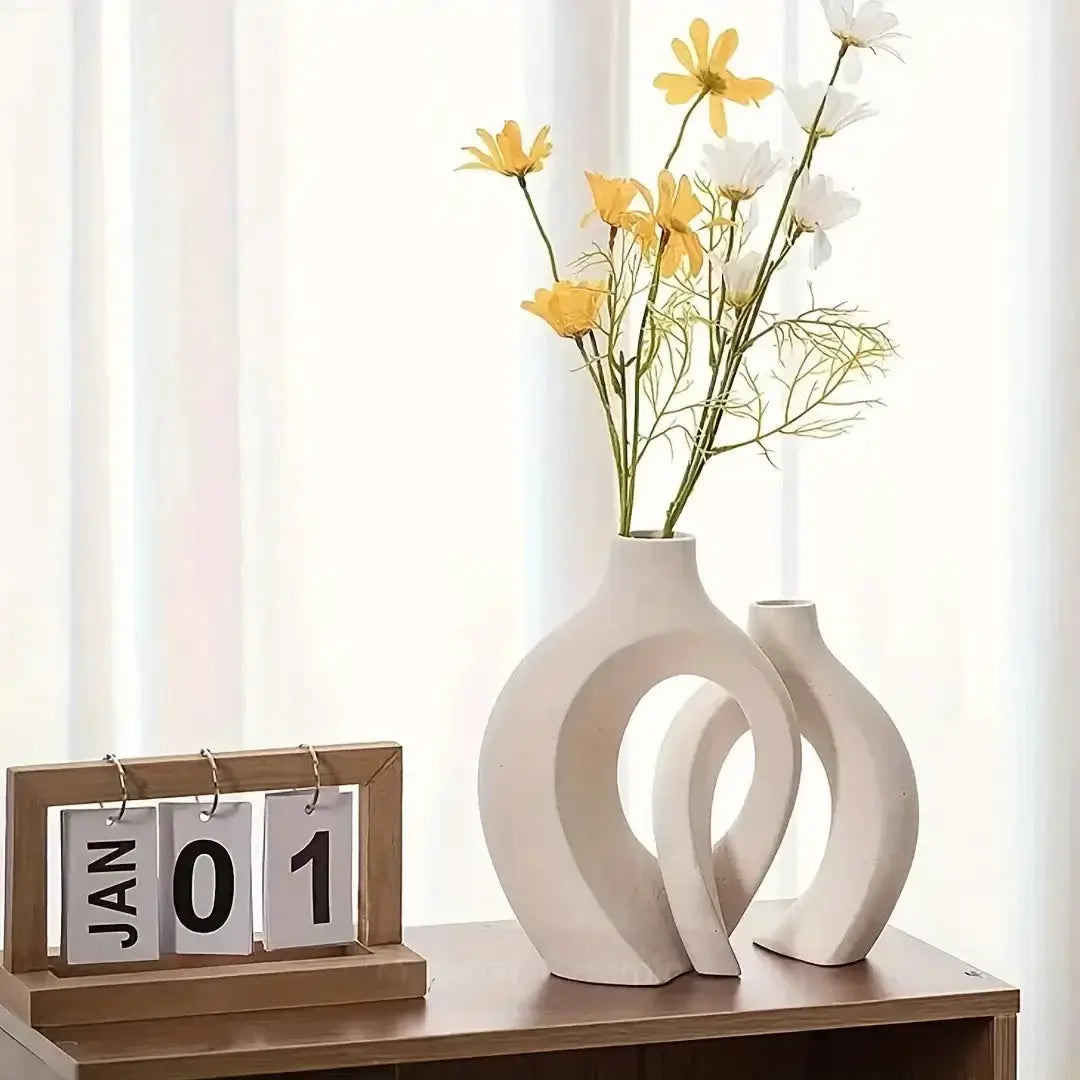 Chic Boho Ceramic Vases Set with flowers on a wooden table, enhancing modern decor and stylish aesthetics.