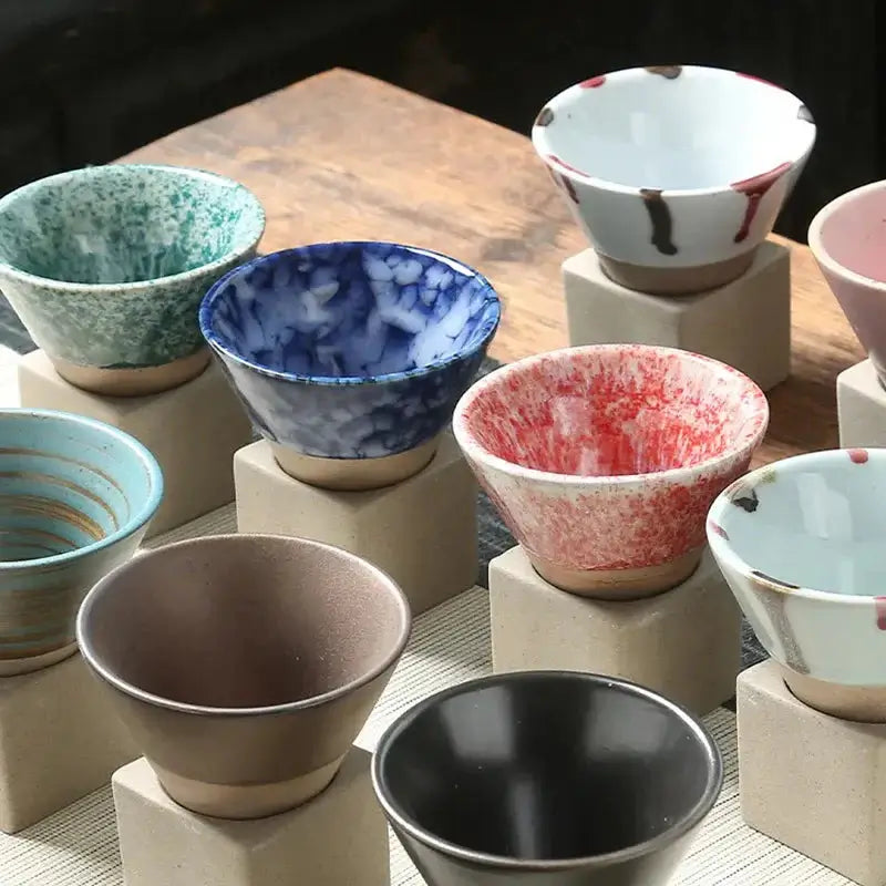 Japanese Retro Ceramic Coffee Cup set featuring various colorful bowls displayed on stands.