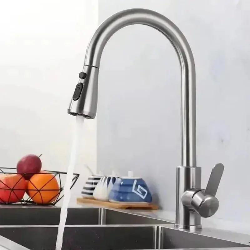Stainless Steel Pull-Out Faucet with a sleek design and adjustable water flow in a modern kitchen setting.