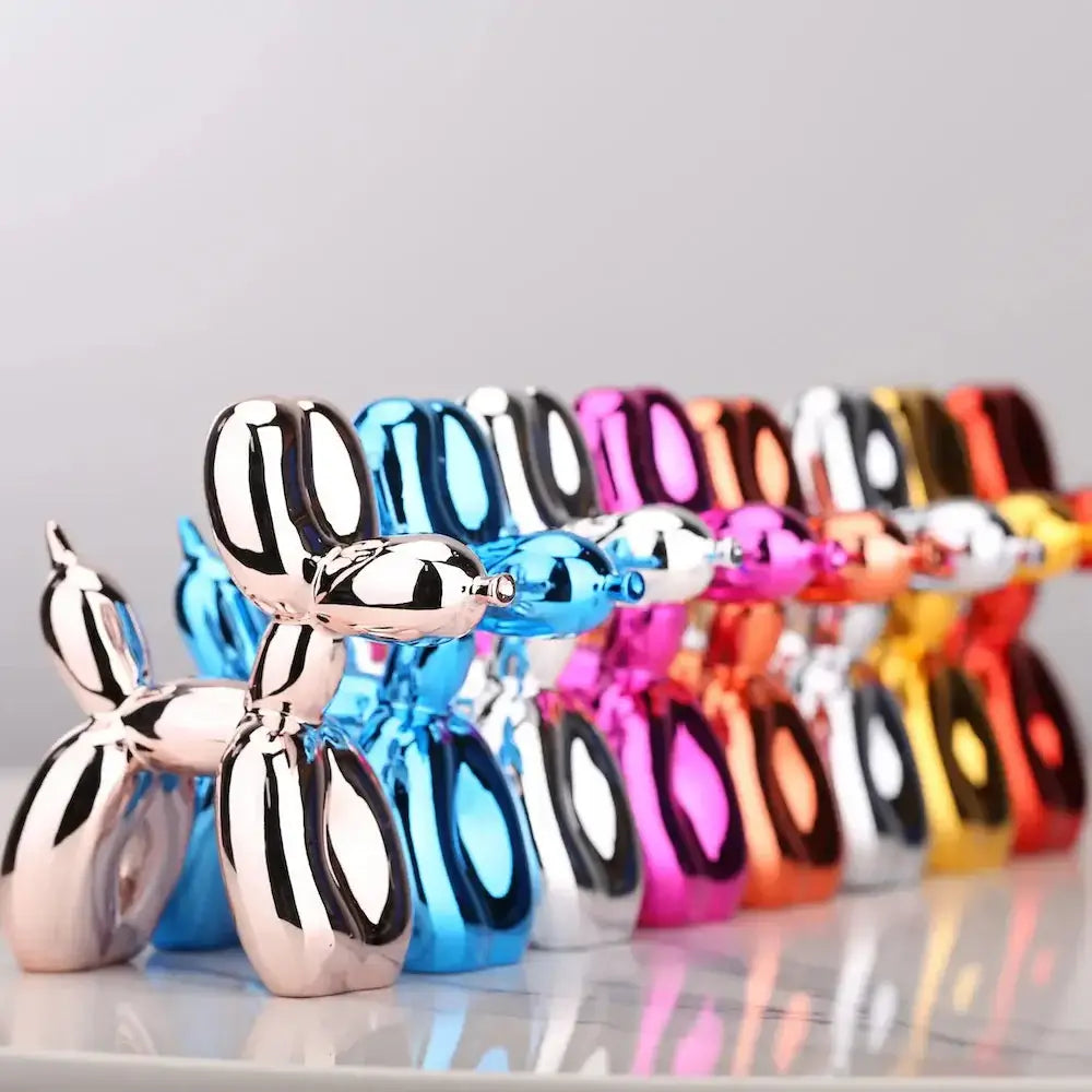 Colorful display of Mini Ceramic Balloon Dog Statues in various glossy finishes.