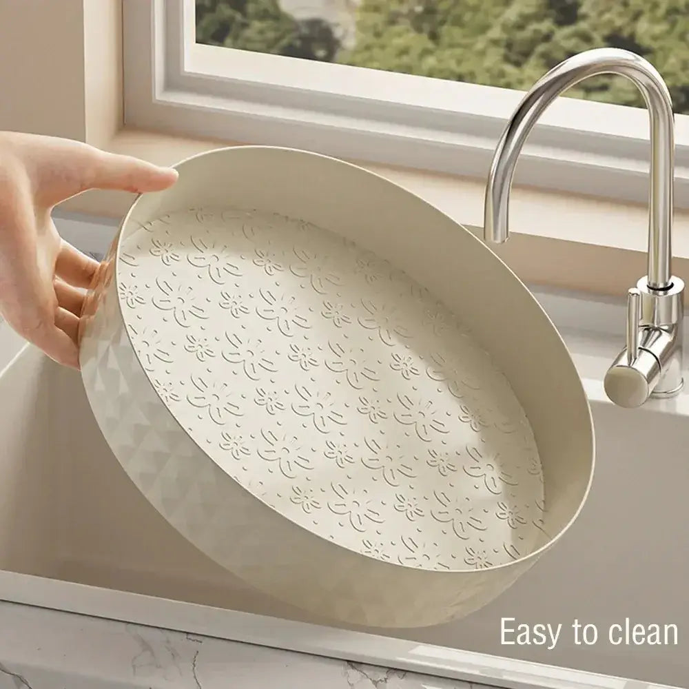Person holding a 360-degree spice organizer in a sink, showcasing its easy-to-clean design.