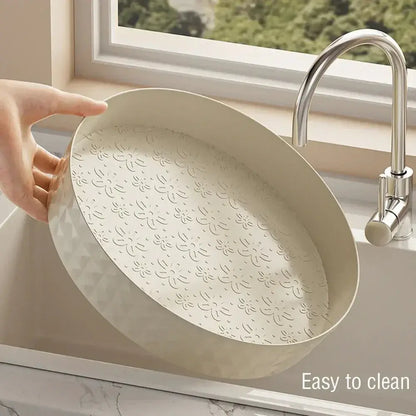 Person holding a 360-degree spice organizer in a sink, showcasing its easy-to-clean design.