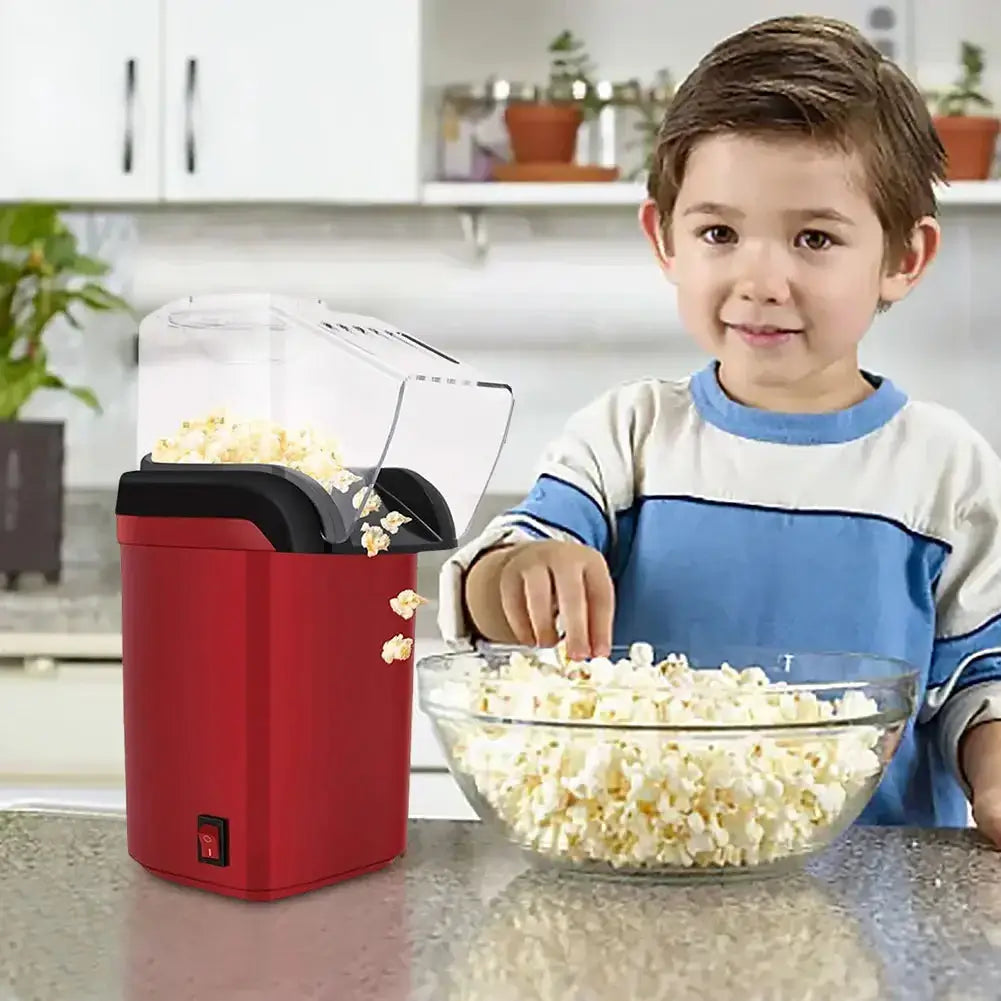 Home Hot Air Popcorn Maker in use with a boy enjoying popcorn in a bowl in a kitchen setting.