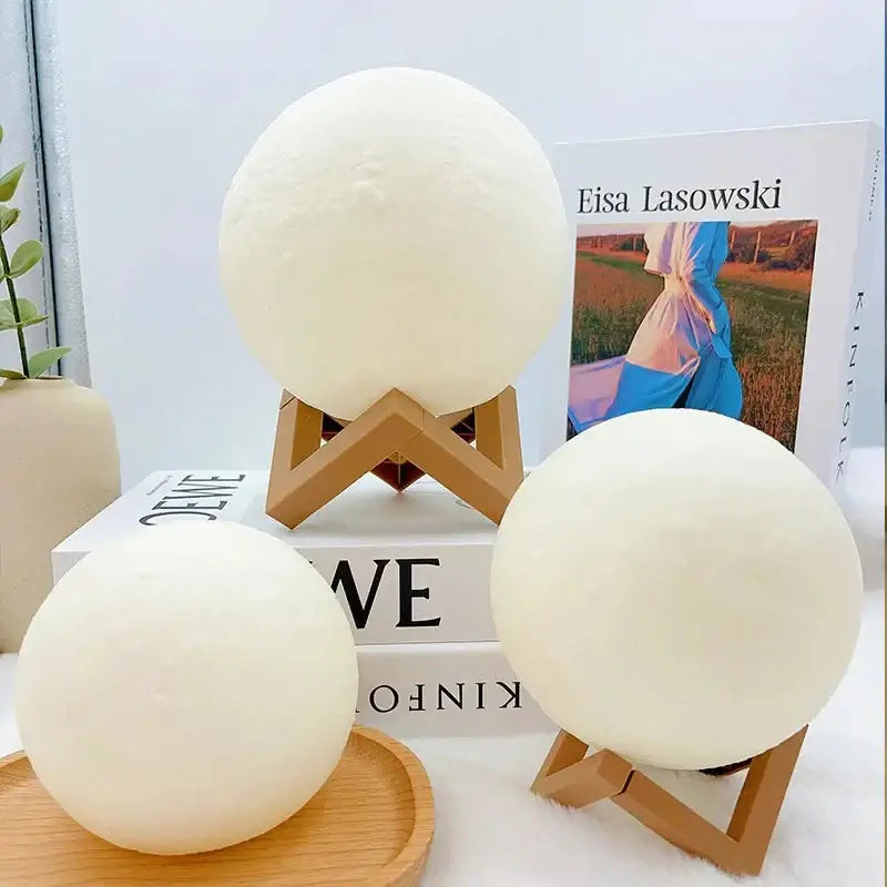 DIY Moon Light Night Kit from NestNexus displaying creative night light designs on wooden stands.